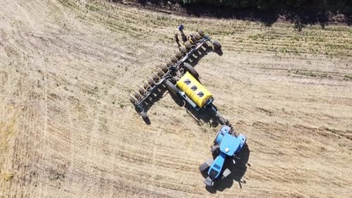 Blue Tractor O.A. Planting Canola On No Till Field