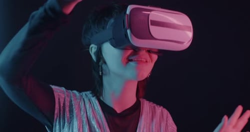 Woman Experiencing Virtual Reality Technology with Headset