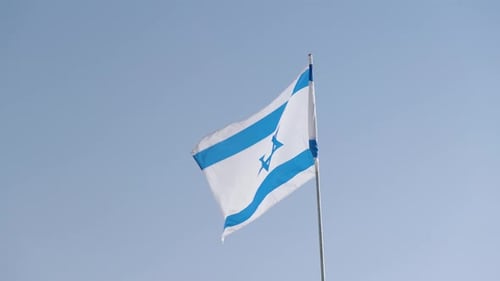 Israeli Flag Waving Against a Clear Sky