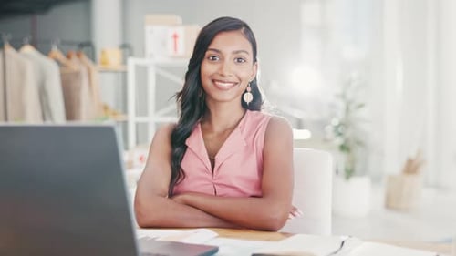Confident Woman Smiling at Desk in Office