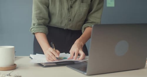 lady freelance focus on work finance graph account chart market plan in laptop for remote meeting.