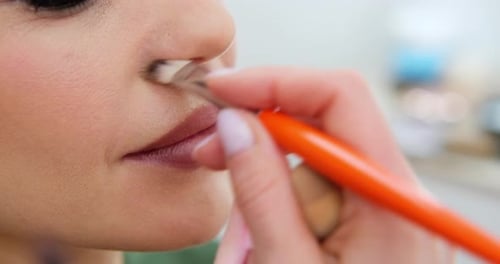 Close Up Professional Lips Makeup Beautician Applies Lipstick Beautiful Woman Face Hand of Makeup