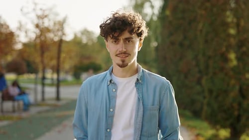 Caucasian Handsome Smiling Man Standing Outside the Street and Looking at the Camera Portrait of the