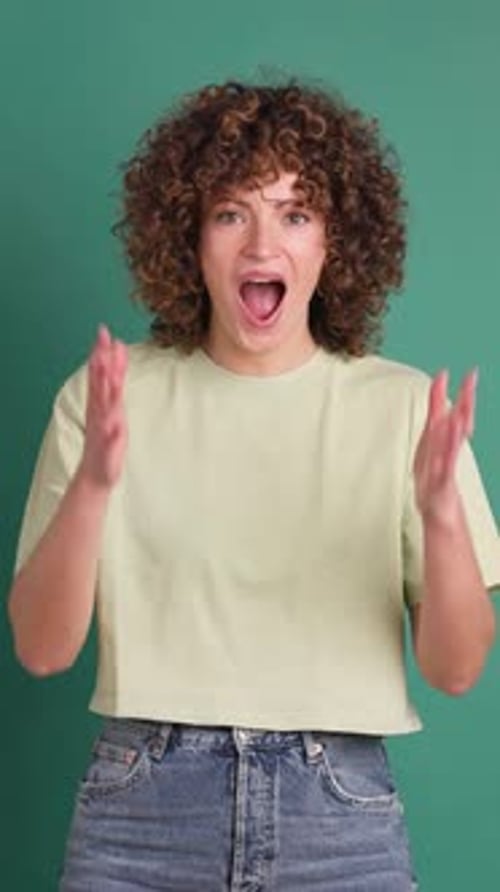 Woman Surprised on Green Background Vertical Orientation