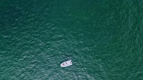 Sailing Catamaran Floating Water Surface Top View. Drone Luxury Sailboat Cruising Deep