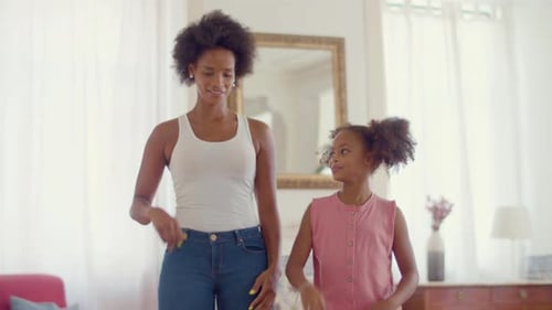 Woman and Child Enjoying Themselves At Home