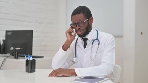Doctor Experiencing a Headache or Stress, Rubbing Temple