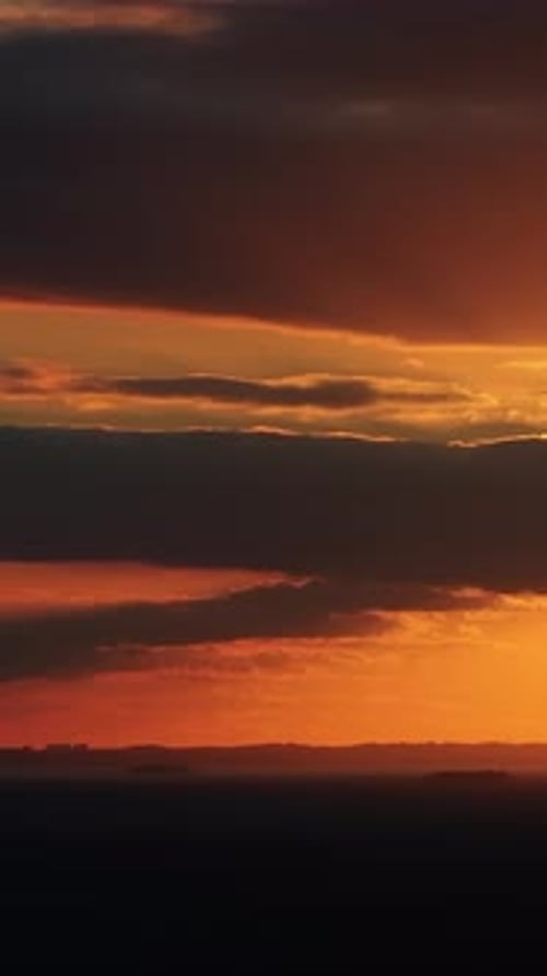 Aerial drone view of the horizon at sunset. Vertical
