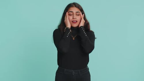 Woman Rubbing Temples Experiencing Headache