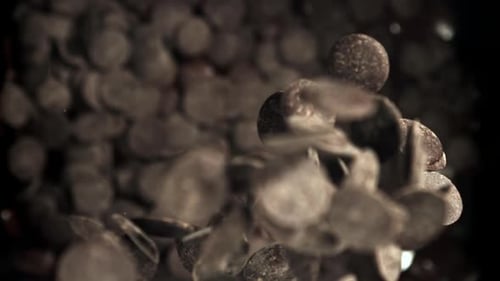 Chocolate Chips Fall Into Melted Chocolate Filmed on a Highspeed Camera at 1000 Fps