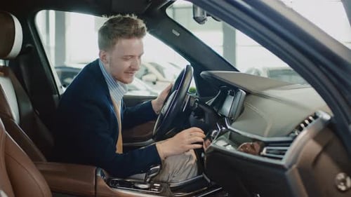 Man Inspecting Interior of New Car
