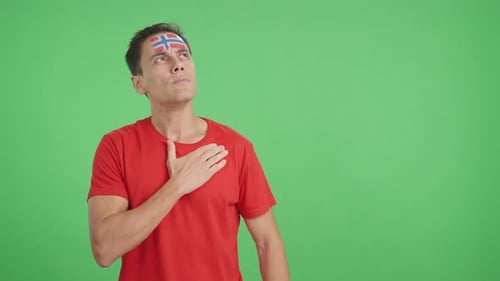 Man Listening to the Norway National Anthem with Solemnity