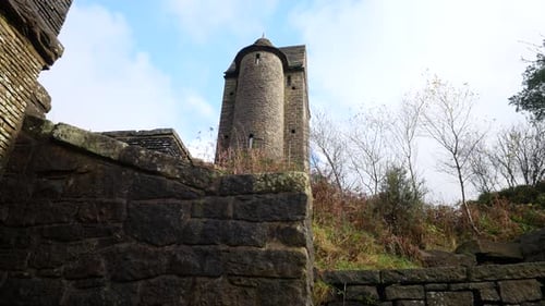 Landmark stone pigeon tower tall English rural autumn historic fairy tale building low angle left do