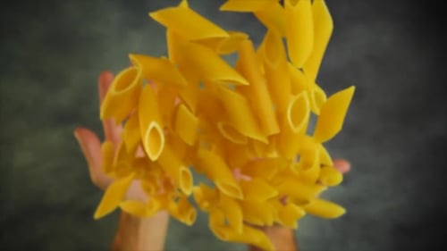 Uncooked Pasta Thrown Upward Towards the Camera