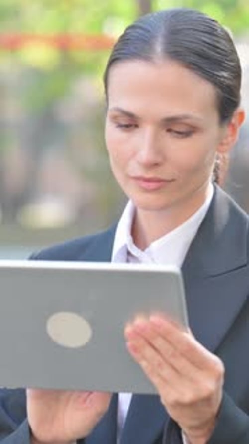 Portrait of Business Woman Using Tablet Outdoor