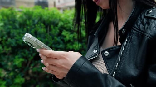 Young Woman Using Smartphone Device Outdoors