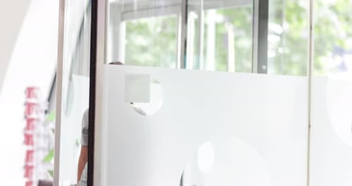 Businesswoman arriving at corporate office reception for a meeting