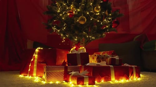 Christmas tree with red and gold ornaments gifts