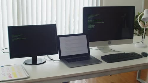 Computer Screens with Design Applications and Code