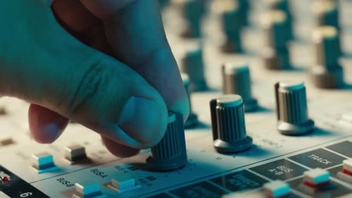 Music Studio Close Up Close Up Hands Shot of Sound Engineer Using Mixing Console Remote Control for