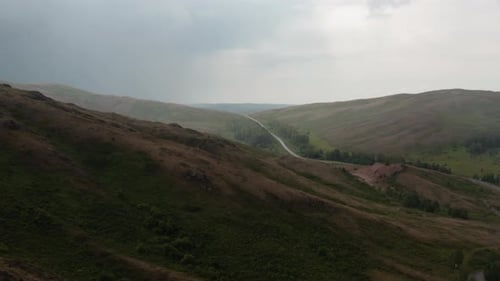 Rolling Green Hills with a Curving Road