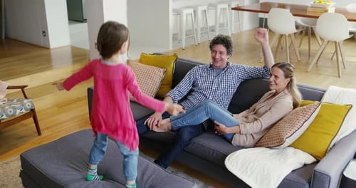 Happy Family Hugging and Playing at Home