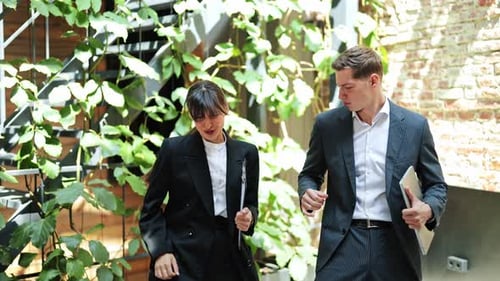 Business Partners Dance and Celebrate Success in Modern Office