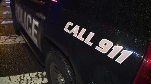 PARKED CALL 911 POLICE CRUISER AT NIGHT W LIGHTS ON