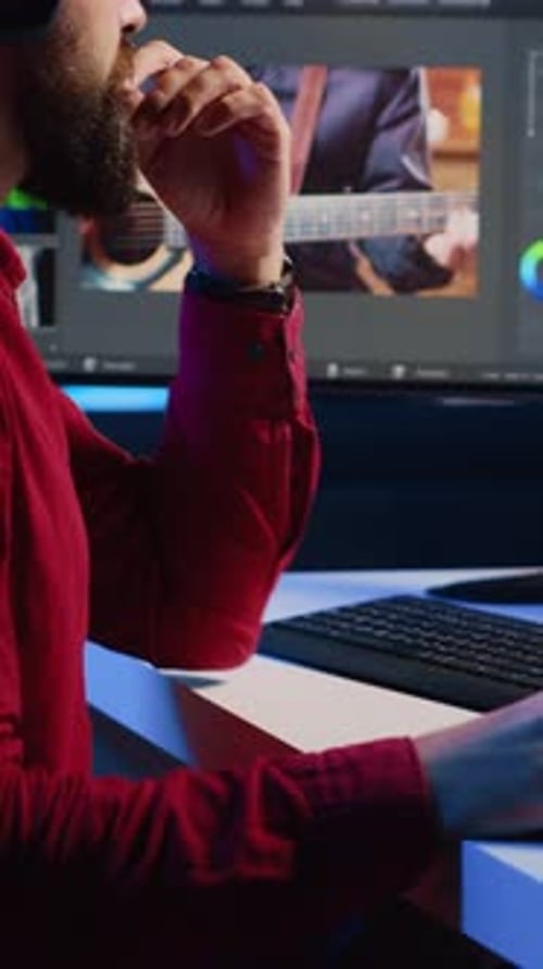 Editor Working on Music Video at Computer