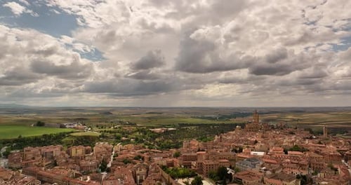 Drone footage zooming out to reveal the Roman aqueduct of Segovia, Spain, highlighting the historic