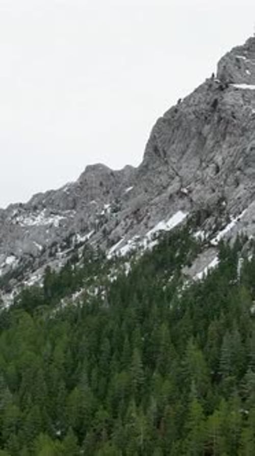 Vertical Video Aerial Paradise Winter Mountain Forest with River and Majestic Waterfalls