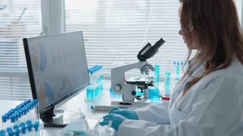 An Experienced Scientist Analyzes Complex Data Sets in a Modern Lab Conducting Significant