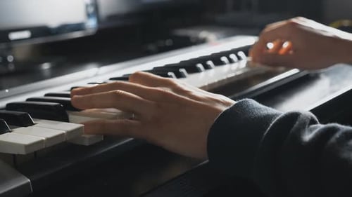 Hands of Male Musician Playing at Synthesizer Arms of Man Plays Solo of Music at the Piano Slow