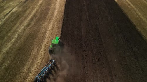 Tractors plowing the field in Ukraine
