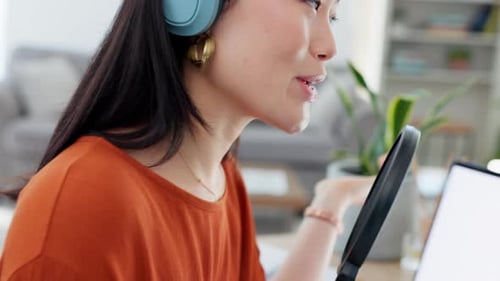 Young Woman Speaking Into Microphone