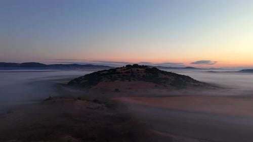 Aerial Flyover of Morning Fog and Golden Light on Peaceful Countryside