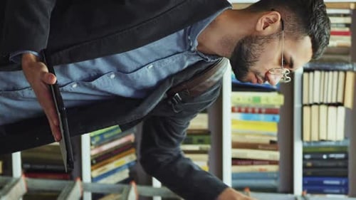 Vertical Screen: Student looking for books in library