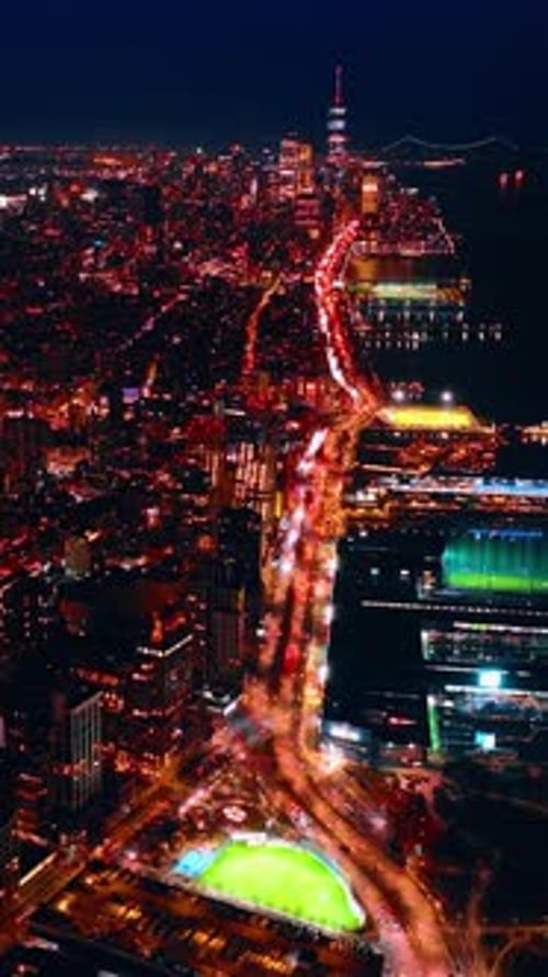 Well-illuminated highway along the dark waterscape in New York, USA.