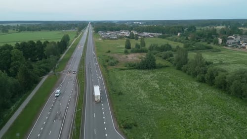 Scenic Aerial View of Serene Country Road and Lush Landscape Perfect for Photography or a Relaxing