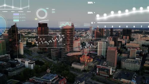 Aerial view of futuristic cityscape with digital data visualizations and infographics overlays.