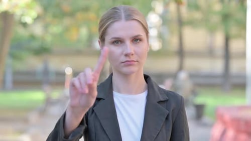 Outdoor Portrait of Tense Businesswoman in Denial
