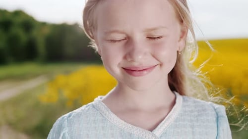 Adorable Girl with Pretty Face Posing at Summer Field