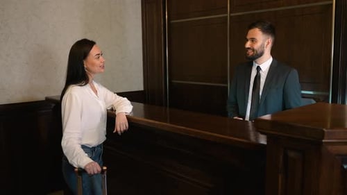 Female Guest Checking in at a Luxury Hotel Reception Desk