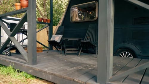 A mobile home with a terrace is located in country glamping site for relaxation and solitude nature
