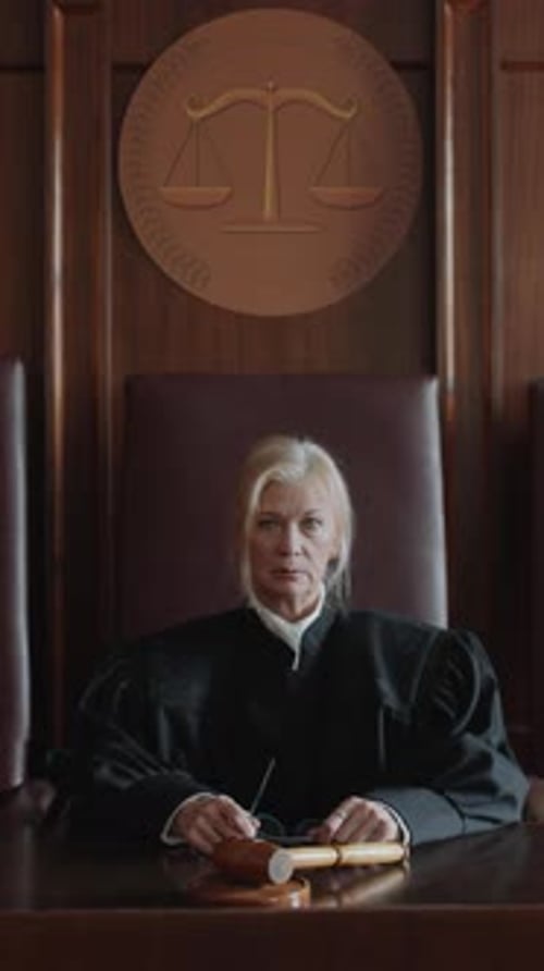 Female Judge Presides at Court Bench with Gavel