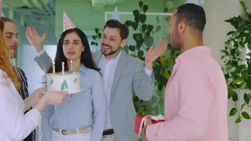 Staff Celebrating Colleague's Birthday in Business Office with Cake and Candles Happy Birthday