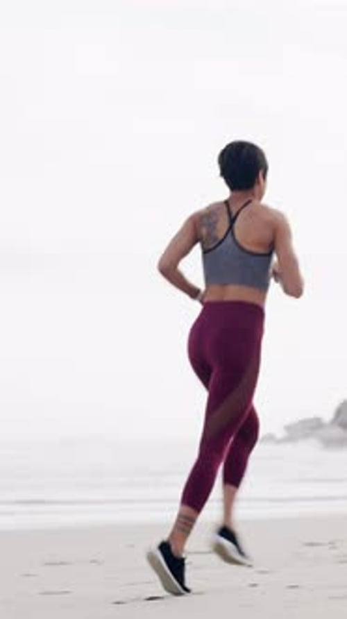 Back, fitness and running with woman on beach in morning for cardio improvement or training