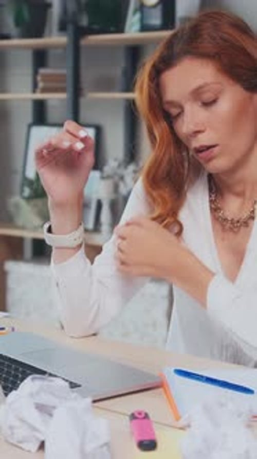 Stressed Woman Working at Her Desk