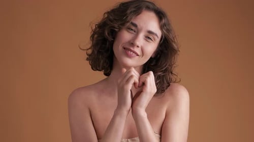 Happy Young Woman Posing in Studio