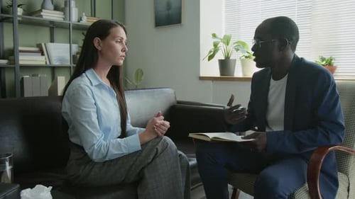 Woman Discussing Problem with Psychologist during Counselling Session